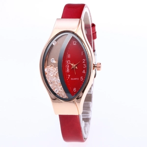 Detail view of the rose gold watch case with floating crystals and red quartz dial