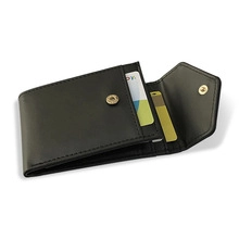 Detailed view of black PU leather bifold wallet with snap closure and interior card slots