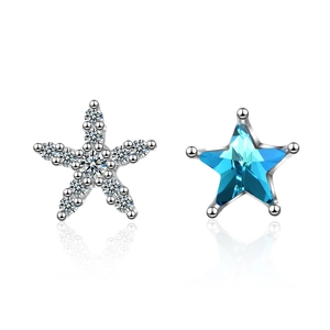 Asymmetric blue star stud earrings with sparkling white crystals on silver base