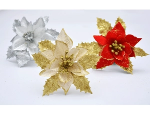 Close-up of artificial Christmas flowers with glitter petals in gold, silver and red