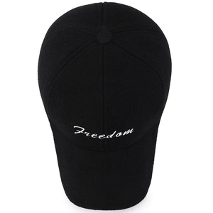 Classic black wool baseball cap with white Freedom embroidery in a minimalist outdoor style