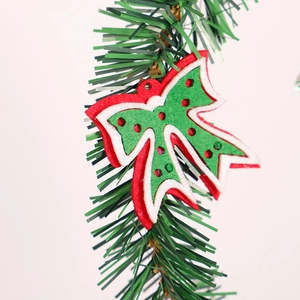 Green PVC Christmas wreath with red and white felt bow decoration for home holiday decor