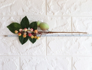 Detail of artificial berry branch showing length measurement on a white background