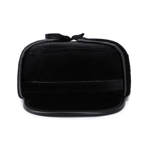 Winter men's faux fur trapper hat with ear flaps and black leather trim on white background