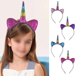 Close-up of holographic unicorn horn and glitter ears on a black girls headband