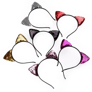 Detail shot of six colorful sequin cat ear headbands on black metal frames