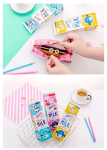 Detailed view of milk carton pencil cases with zippers showing inner stationary storage