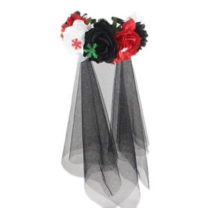 Detail of red and white artificial flowers with black mesh veil for carnival parties