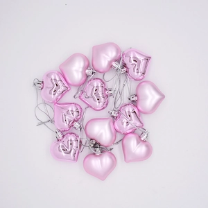 Pink heart-shaped Christmas ornaments with shiny and matte finishes for tree decor