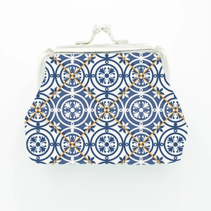 Close-up of Morocco style canvas coin purse with blue geometric pattern and metal clasp