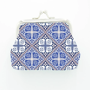 Close-up of Morocco style fabric coin purse with traditional geometric pattern and kiss-lock