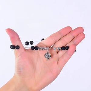 Detail showing the high-strength elastic string of the lava stone tree of life bracelet