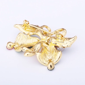 Detail of the golden alloy Christmas brooch back showing secure safety pin closure