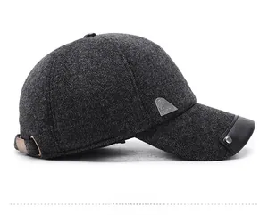 Detail view of winter wool baseball cap with metallic logo and leather brim trim