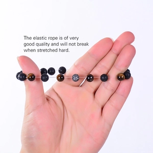 Detailed view of elastic tiger eye and lava stone bracelet showing high flexibility and durability