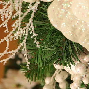 Christmas upside down tree decoration with green pine needles and white glitter berries