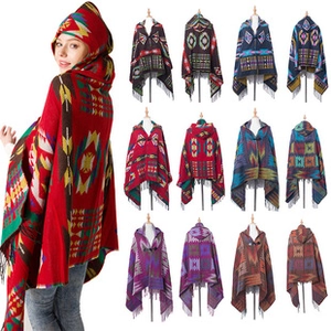 Detail of hooded plaid poncho featuring geometric patterns and soft knit texture