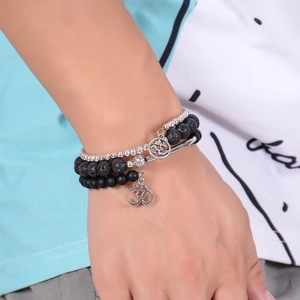 Multi-layer volcanic lava stone bracelet with silver metal beads and Om charm for yoga