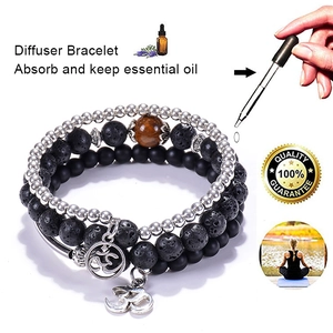 Three-piece energy lava stone diffuser bracelet set with silver beads and Om charm