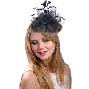 Detailed view of elegant black mesh veil and feather floral fascinator for weddings