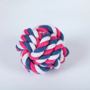 Close-up of a durable three-color cotton rope ball toy for dog teething and chewing