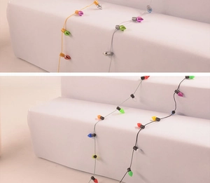 Close-up of colorful plastic Christmas bulb string ornaments in various cable colors