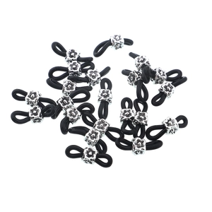 Detail of black silicone anti-slip loops with silver alloy flower beads for DIY eyeglass chains