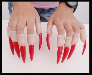 Detail of glossy red long finger claws prop for Halloween party costume makeup