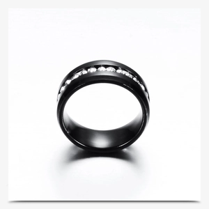 Close-up of a matte black stainless steel ring with channel-set round white diamonds