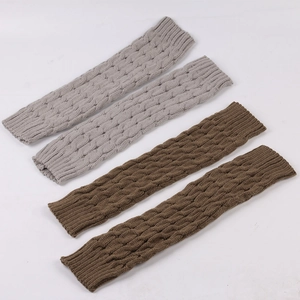 Detail of cable knit leg warmers in grey and brown showing the thick woven texture