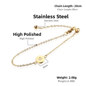 Detail of 8mm gold stainless steel circle pendant with crystal on minimalist chain