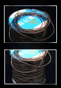 Detail of coffee brown elastic crystal cord on a spool for DIY jewelry making