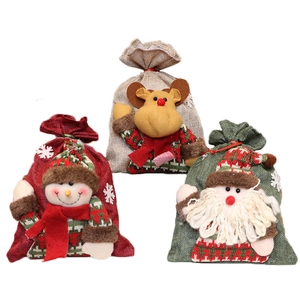 Three Christmas burlap drawstring gift bags with Santa, Reindeer and Snowman designs