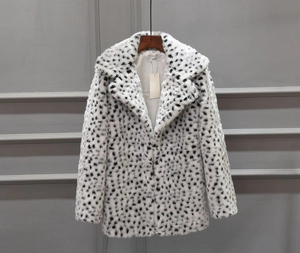 Macro detail of high-quality leopard print faux fur texture and notch lapel design