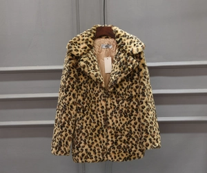Detail of premium faux fur texture and leopard print pattern on the mid-length coat