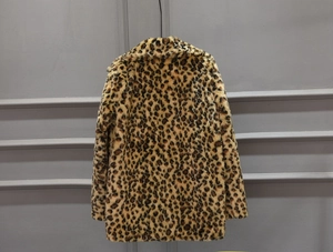 Back view detail of mid-length faux fur coat with classic leopard print pattern