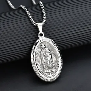Macro view of Guadalupe Virgin Mary relief pendant on vintage stainless steel necklace