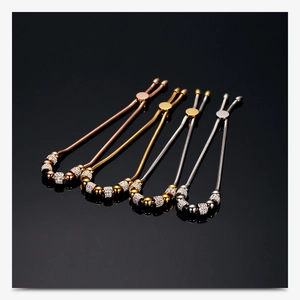 Detail of adjustable stainless steel bead bracelets with rhinestones in four metallic tones