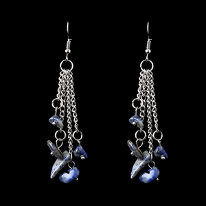 Detail of blue crystal stones on multi-layer silver tassel chain drop earrings