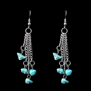 Detail of silver long chain tassel earrings with irregular blue crystal stone beads