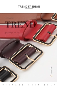 Detail of fashion wide waist belts for women with textured leather and square metal buckles