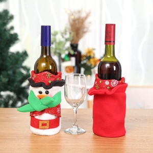 Christmas wine bottle covers featuring snowman and red skirt designs for holiday decor