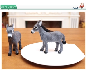 Detailed view of realistic gray plush deer figurines for Christmas tabletop decoration