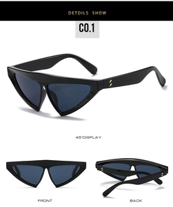 Close-up of triangle sunglasses with black frames and gold double-dot hinge accents