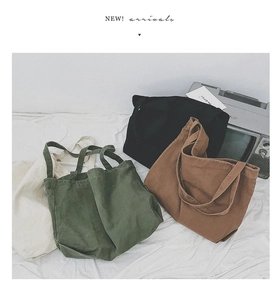 Detail of minimalist canvas tote bags in four colors including army green and brown