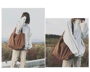 Detail of a large capacity brown canvas tote bag in a vintage minimalist aesthetic