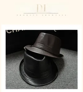 Detailed view of black and brown vintage leather fedora hats with fine stitching