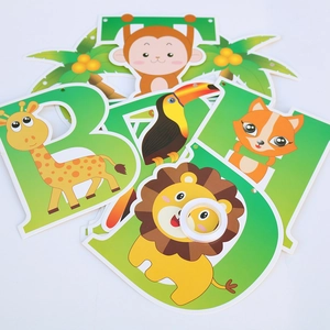 Close-up of animal-themed Happy Birthday banner cards featuring lion and giraffe patterns