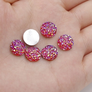Close-up of 10mm red resin druzy flatback cabochons for DIY jewelry making and crafts
