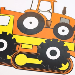 Close-up of vibrant cardboard orange tractor and yellow bulldozer party decorations